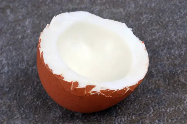 Half Boiled Egg Its Yolk Close Gray Background — Φωτογραφία Αρχείου