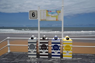 Waste sorting containers for recycling in the city of Gijon in Spain in front of San Lorenzzo beach 
