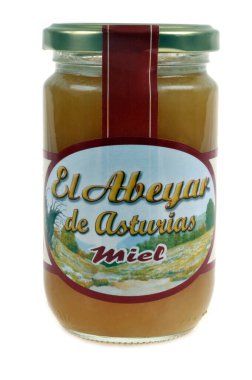 Beyaz arka planda Asturias 'tan bir kavanoz bal.