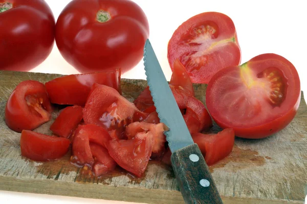 Tomatoes Cut Small Pieces Knife Cutting Board Close — Foto de Stock