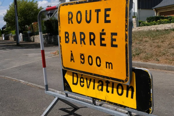 Signs indicating road closure and diversion
