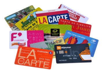 Assortment of loyalty cards close up on white background 