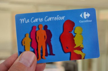 Carrefour store loyalty card held in hand close up