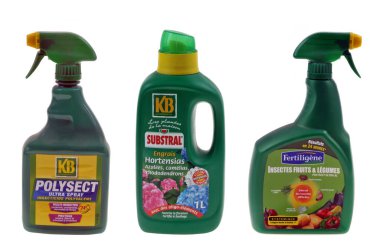 Spray bottles and canister of garden chemicals close up on white background 