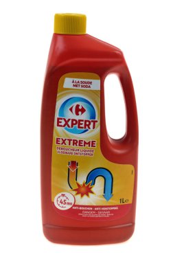 Bottle of Carrefour Expert brand liquid opener close-up on a white background