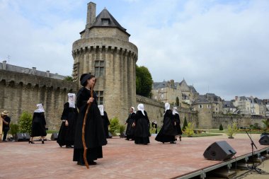 Vannes, France, August 15, 2022 : Dancers in traditional Breton costume at the Arvor festival in Vannes in Brittany