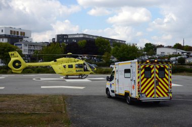 Ambulance and helicopter from Samu des Pays de la Loire on the heliport of the Bretagne Atlantique hospital center in Vannes
