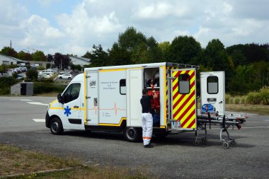 French ambulance with a stretcher and a paramedic from the back