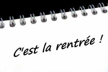It's back to school written in french on a spiral notebook 