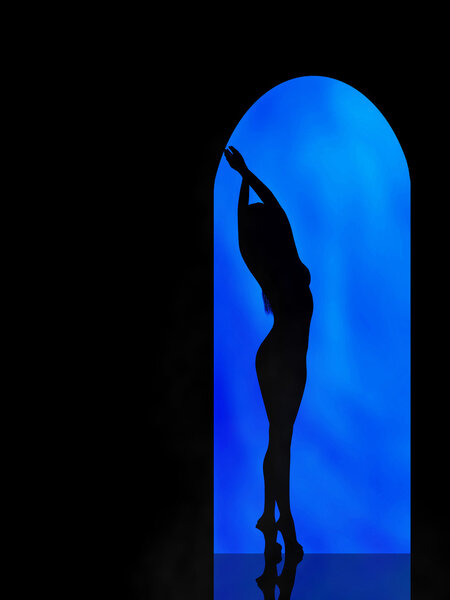 Silhouette of the girl on blue background in the arch