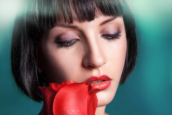 Horizontal portrait of cutie brunette with red rose — Stock Photo, Image