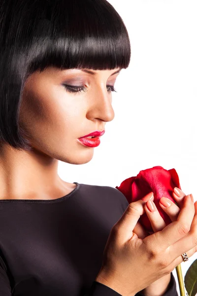 Sensual woman looking down in studio on white background — Stock Photo, Image