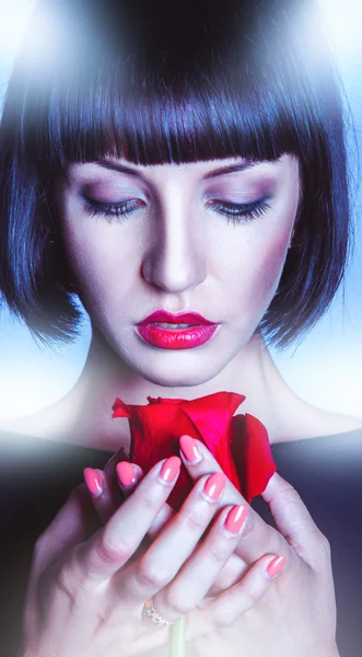 Vertical shoot of pretty brunette with red rose — Stock Photo, Image