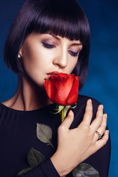 Attractive female with closed eyes and red rose — Stock Photo, Image