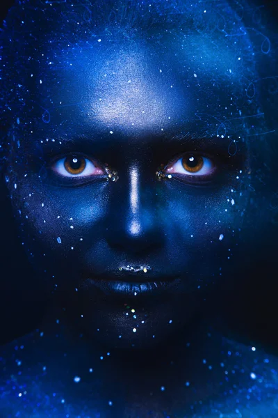 Blue tones portrait of cute woman with dark face art — Stock Photo, Image