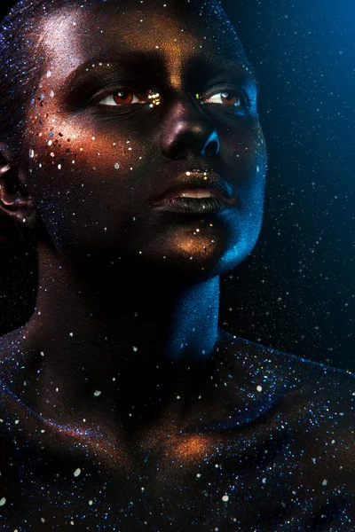 Woman face with dark make up and stars on black background — Stock Photo, Image