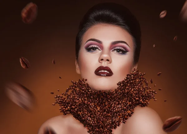 Creative photomanipulation with coffee beans and beauty woman — Stock Photo, Image