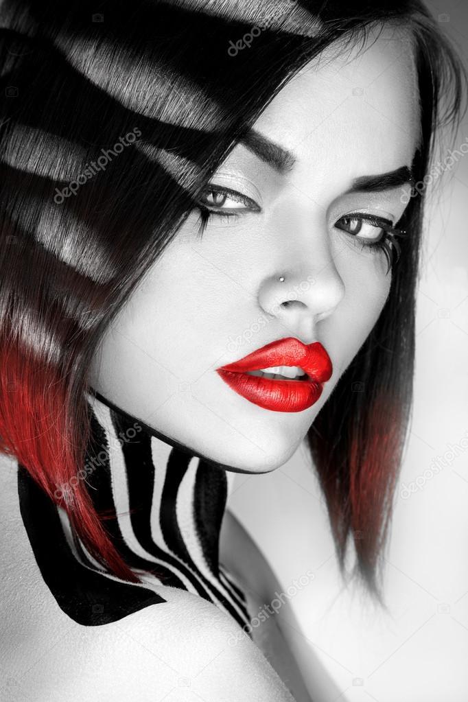 Desaturated portrait of sexy caucasian woman with red lips