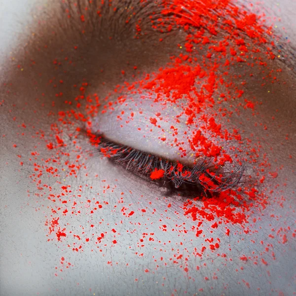 Square macro photo of female eye with neon powder — Stock Photo, Image