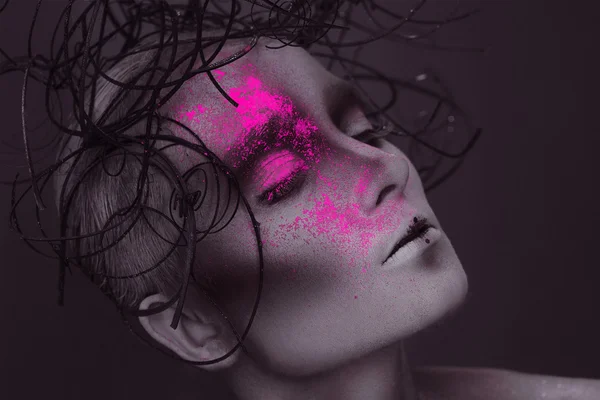Gorgeous woman with pink neon powder on face — Stock Photo, Image