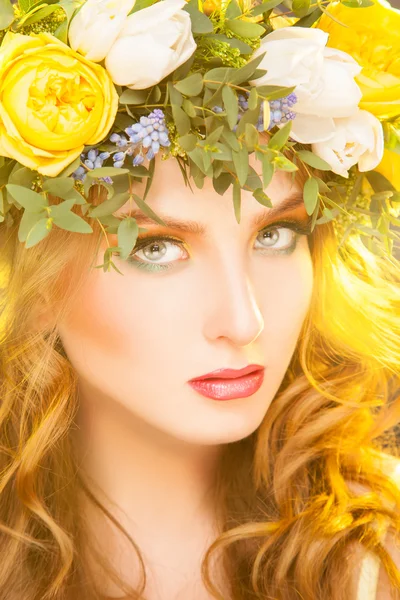 Beautiful woman with wreath on hair looking at camera — Stock Photo, Image