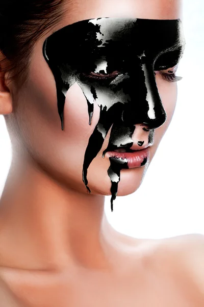 Portrait of caucasian woman with black paint on face — 图库照片