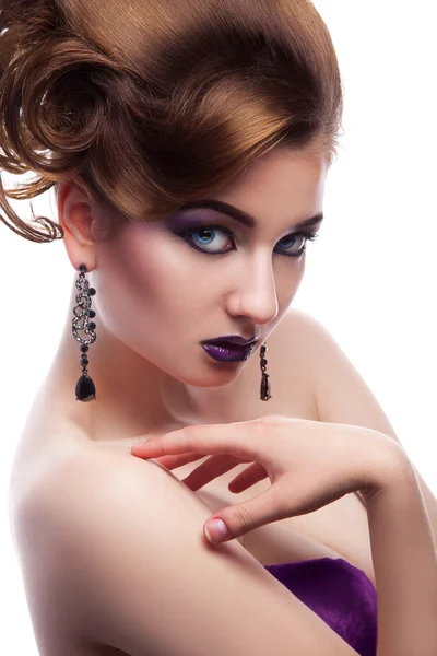 Stunning female looking at camera with make up and creative hair — Stock Photo, Image