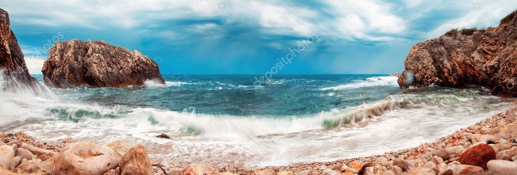 Panoramic photo of storm in the rocky beach