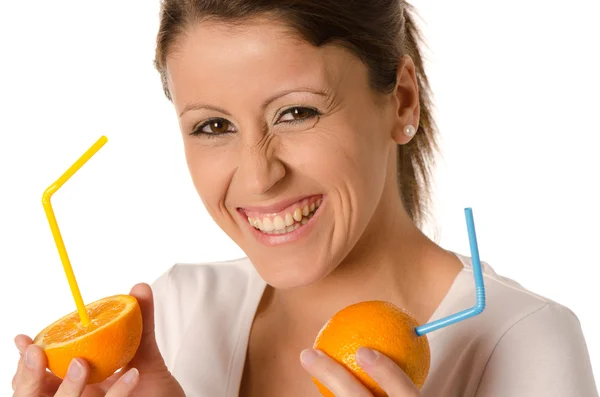 Cute young girl eating a slice of orange — Stock Photo, Image