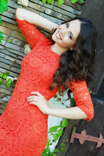 Beautiful woman wearing luxurious red dress — Stock Photo, Image