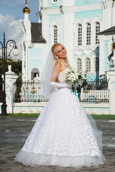 Bride near the church — Stock Photo, Image