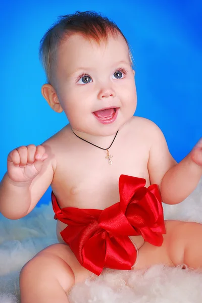 Little child on a blue background — Stock Photo, Image