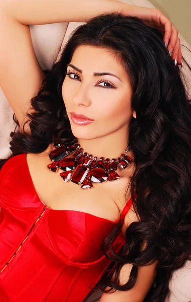 Beautiful woman wearing luxurious red dress — Stock Photo, Image
