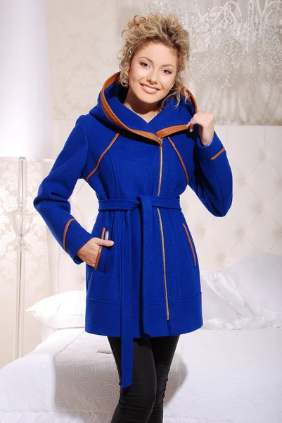 Attractive young blond woman in stylish coat — Stock Photo, Image