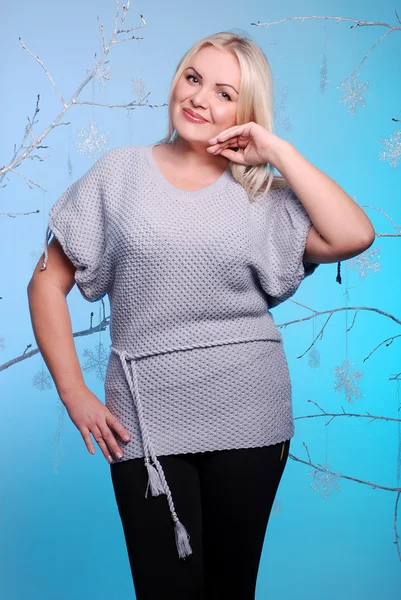 Portrait of young blond woman wearing knitted clothes — Stock Photo, Image