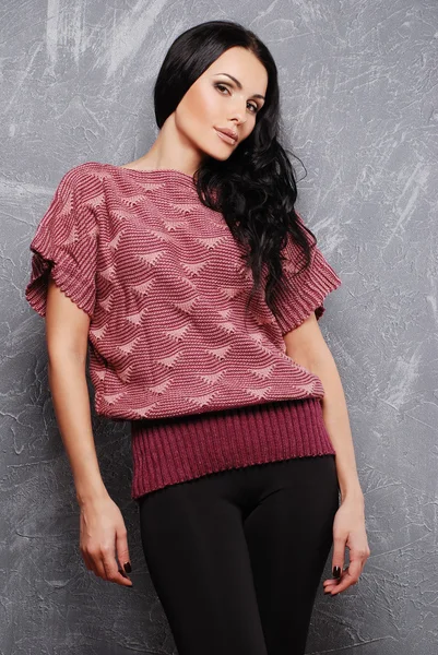 Portrait of a beautiful female model in knitted clothes — Stock Photo, Image