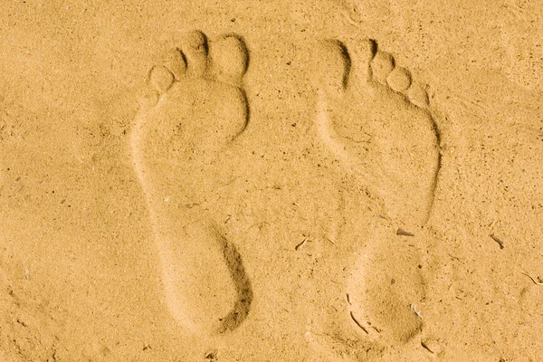 Feet imprint in sand — Stock Photo, Image