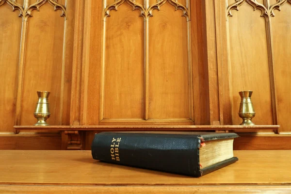 Old Bible in wooden chapel — Stock Photo, Image