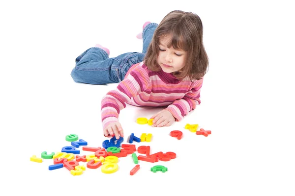 Girl learning with alphabet — Stock Photo, Image