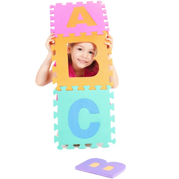 Girl playing with alphabet ABC — Stock Photo, Image