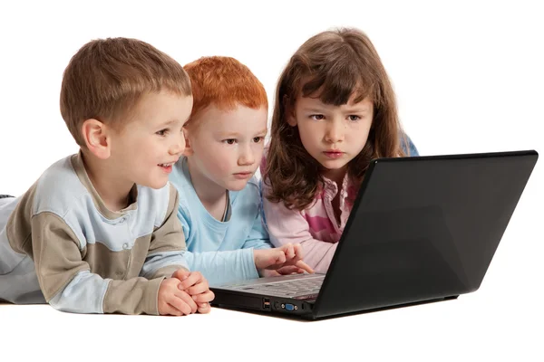 Happy children learning on kids notebook computer Royalty Free Stock Photos