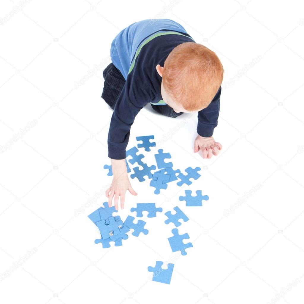 Boy doing puzzle