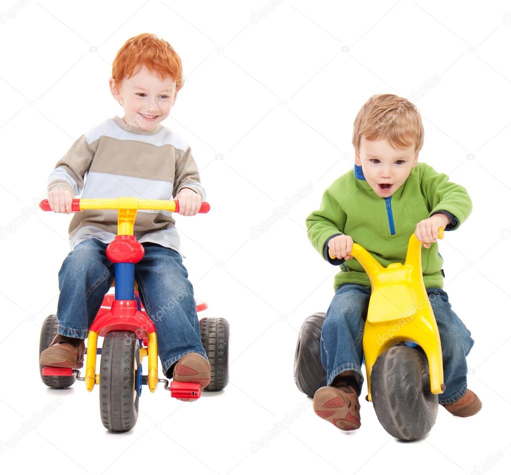 kids riding tricycles