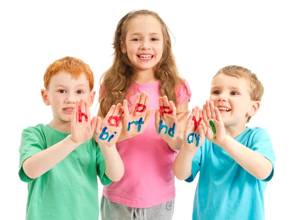 Kids happy birthday painted letters on hands — Stock Photo, Image
