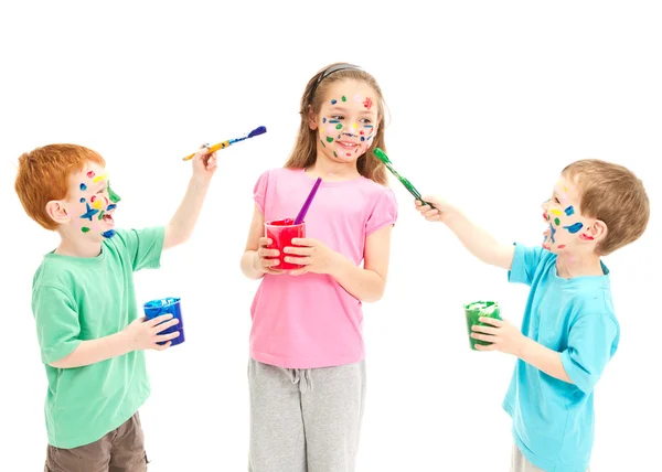 Children painting on each other — Stock Photo, Image