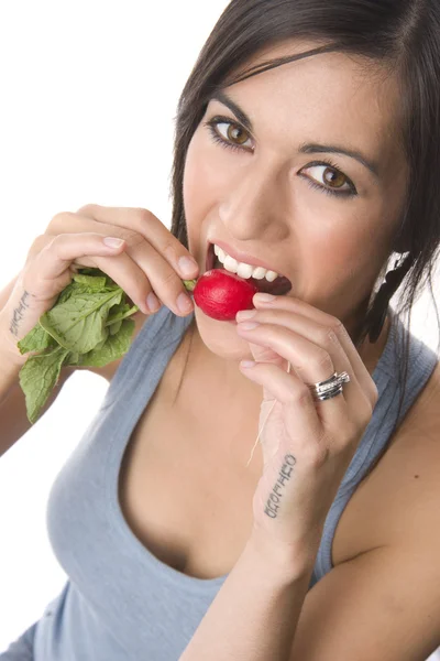 Beautiful Brunette Eats Radish — Stock Photo, Image