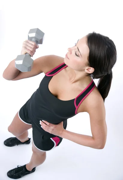 Gesunde brünette Frau stehend Curling Langhantel Gewicht isoliert weiß — Stockfoto