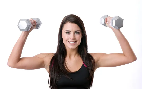 Beautfiul brünette Frau äußert sich positiv hebt Hanteln Low Impact Workout — Stockfoto