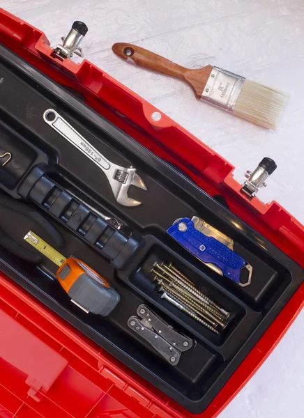 Orange Tool Box with Crescent Tape and Brush — Stock Photo, Image