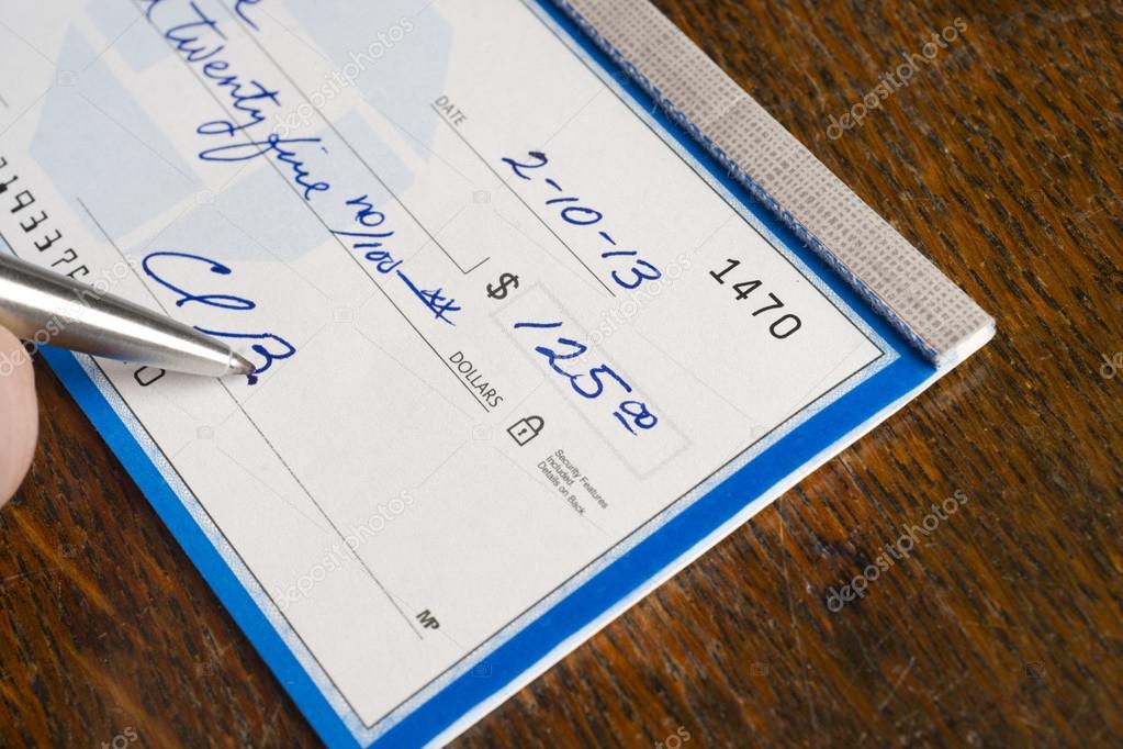Hand Signing Check On Top Of Desk Stock Photo Cboswell 20614993 hand-signing-check-on-top-of-desk-stock-photo-cboswell-20614993